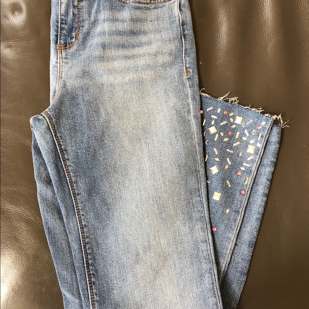 Black Daisy blue jeans with fringe/studs bottom